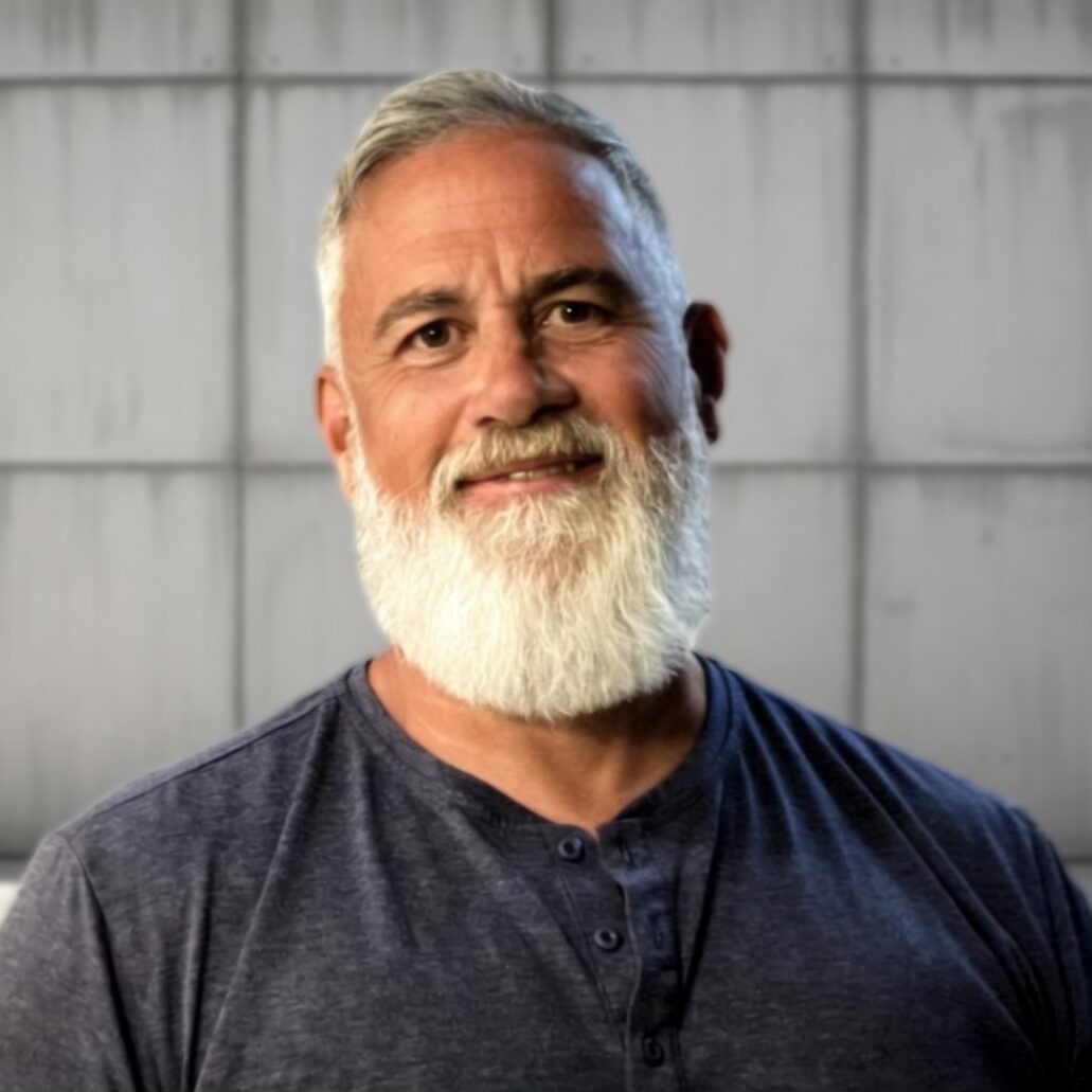 A smiling man with a beard